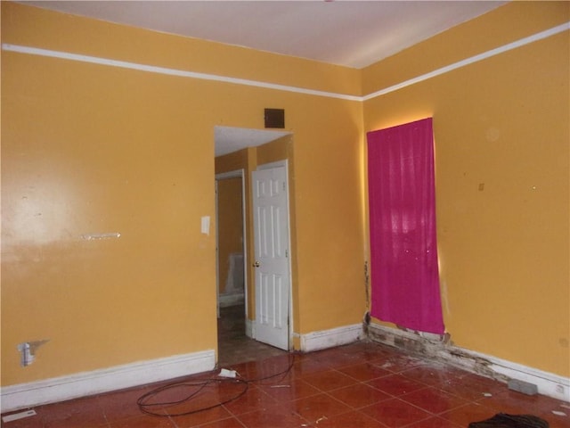 3729 Annunciation St, New Orleans, LA 70115 - spare room featuring dark tile flooring