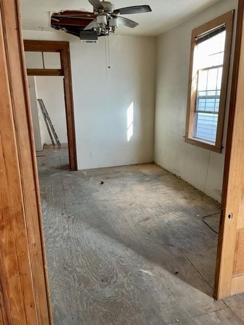 interior space featuring ceiling fan