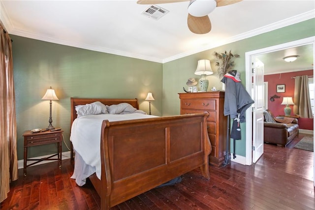 bedroom featuring ceiling fan, ornamental molding, and dark wood-type flooring