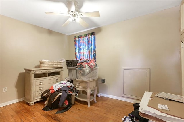 interior space with ceiling fan and light hardwood / wood-style flooring