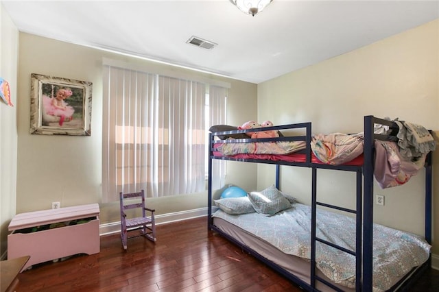 bedroom featuring dark wood-type flooring