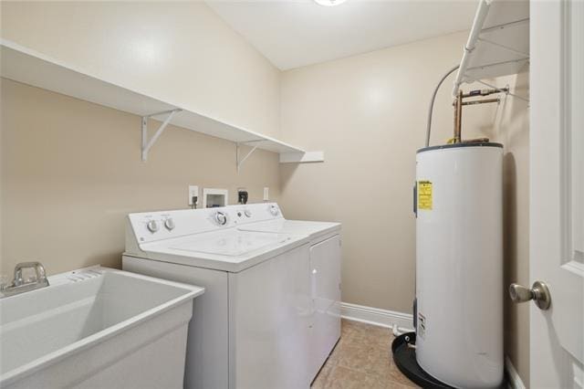 laundry room with washer hookup, light tile floors, washer and dryer, water heater, and sink