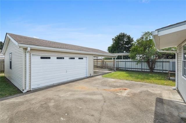 garage with a yard