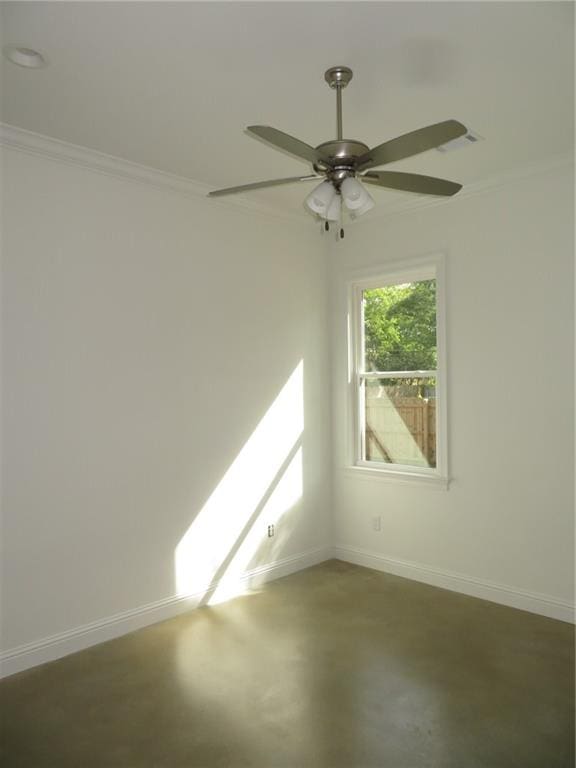 spare room with ceiling fan and ornamental molding