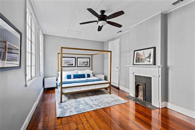 bedroom featuring dark hardwood / wood-style floors and ceiling fan