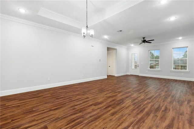 spare room with dark hardwood / wood-style flooring, ceiling fan with notable chandelier, and ornamental molding