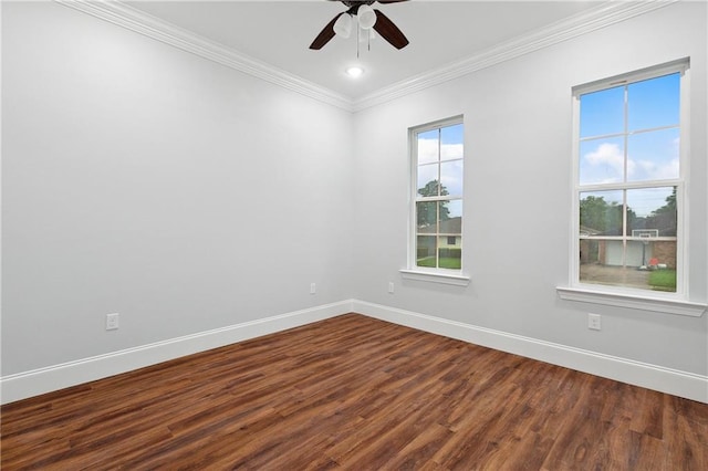 unfurnished room with ceiling fan, crown molding, and dark wood-type flooring