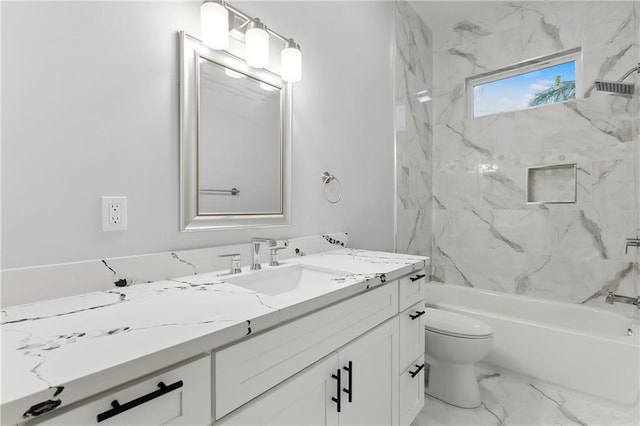 full bathroom featuring toilet, tile floors, vanity, and tiled shower / bath