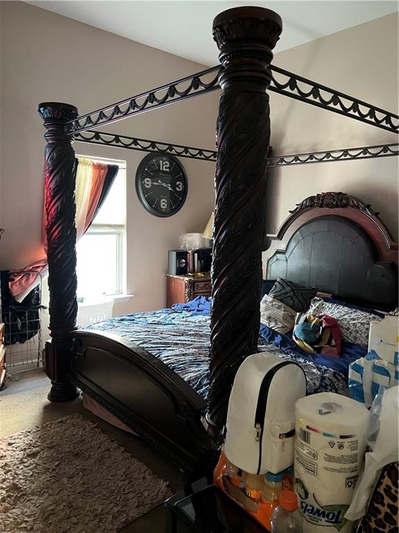 bedroom featuring vaulted ceiling