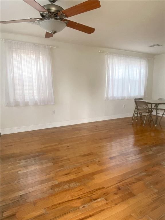 spare room featuring light hardwood / wood-style floors and ceiling fan