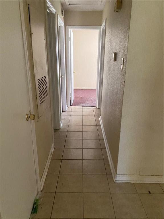 hallway with light colored carpet