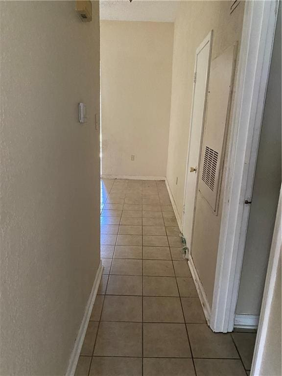 hall with light tile flooring