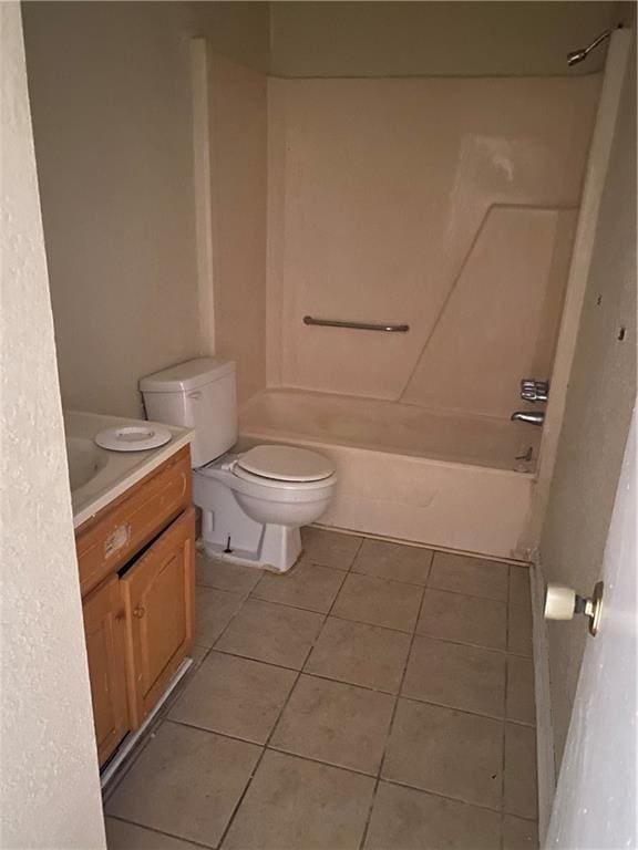 full bathroom featuring tile flooring, bathtub / shower combination, toilet, and vanity