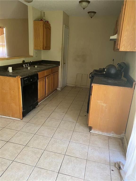 kitchen featuring black dishwasher, sink, ventilation hood, and light tile flooring