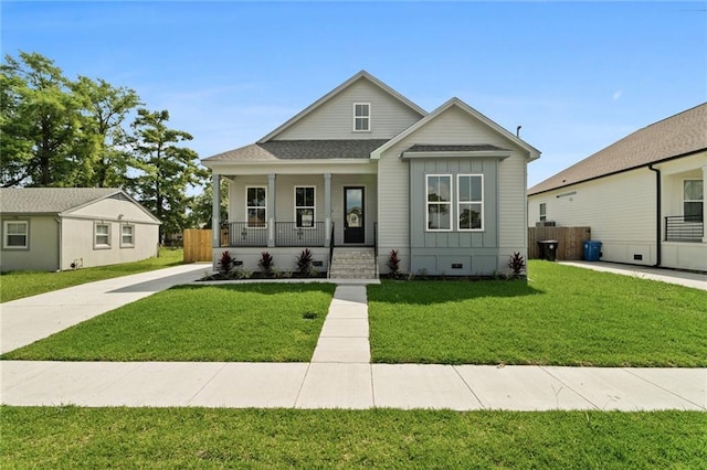 bungalow featuring a front yard and a porch