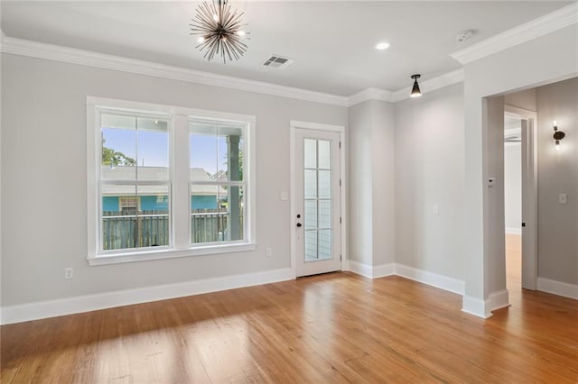 entryway featuring ornamental molding and light hardwood / wood-style floors