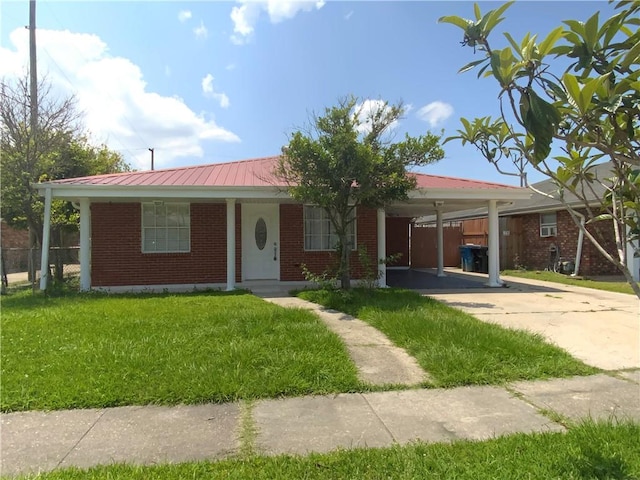 ranch-style house with a front yard and a carport