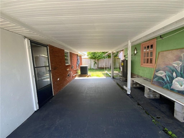 view of patio / terrace featuring electric water heater and central AC