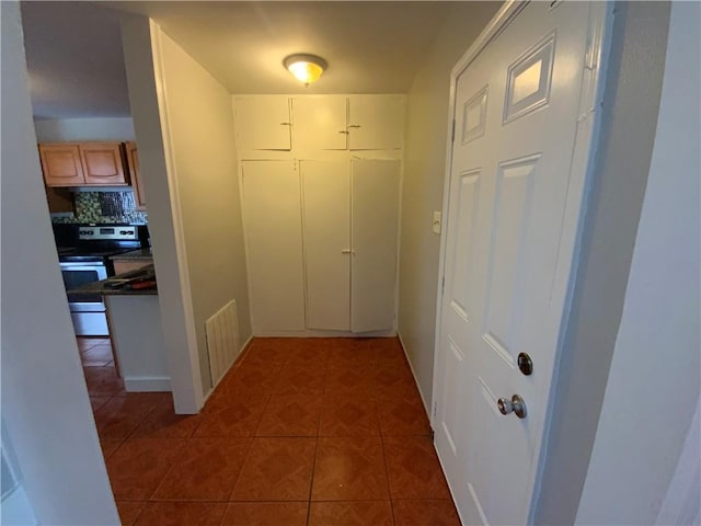 corridor with tile flooring