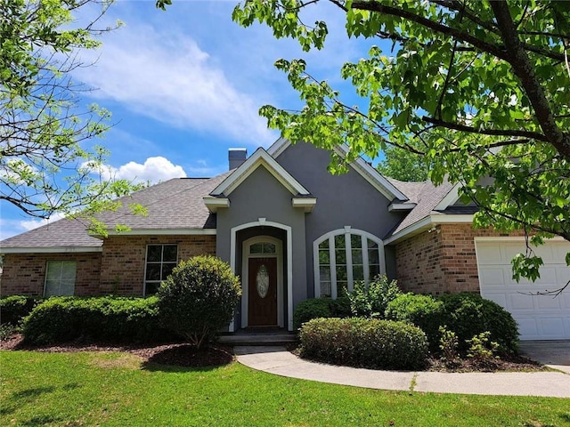 view of front facade featuring a front lawn and a garage