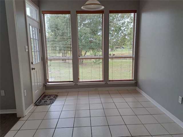 interior space featuring a wealth of natural light and light tile floors