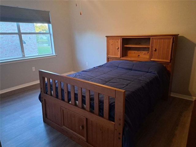 bedroom featuring dark hardwood / wood-style floors