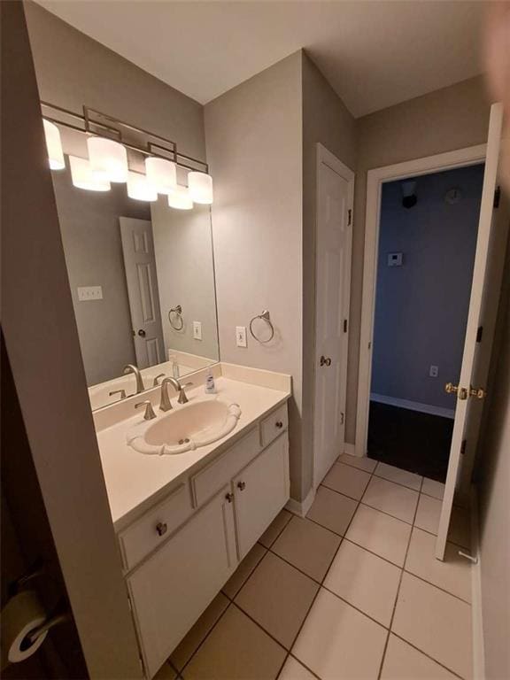 bathroom featuring vanity and tile floors