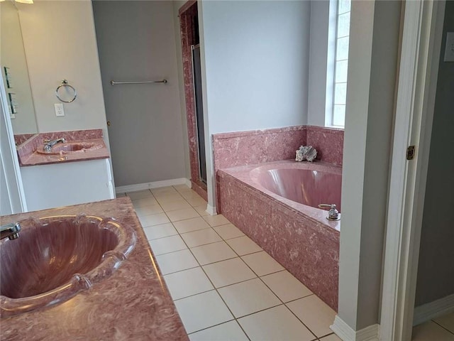 bathroom featuring tile flooring, shower with separate bathtub, and oversized vanity