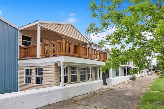 view of side of property with a patio