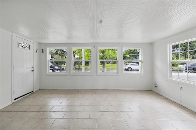 unfurnished sunroom with a healthy amount of sunlight