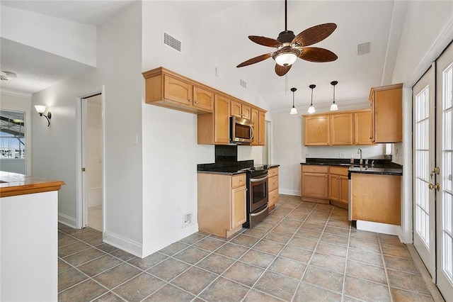 kitchen with hanging light fixtures, tile flooring, stainless steel appliances, and ceiling fan