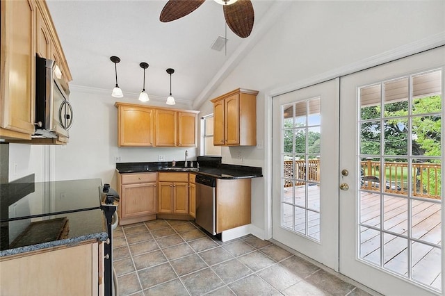 kitchen featuring pendant lighting, ceiling fan, appliances with stainless steel finishes, lofted ceiling, and sink