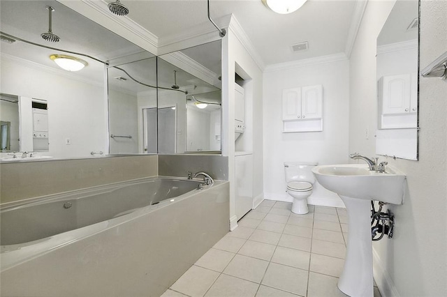 bathroom with a bathing tub, toilet, ornamental molding, and tile flooring