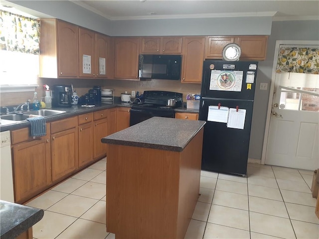 kitchen with sink, light tile floors, a kitchen island, ornamental molding, and black appliances