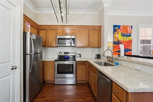 kitchen with tasteful backsplash, ornamental molding, appliances with stainless steel finishes, dark hardwood / wood-style floors, and sink