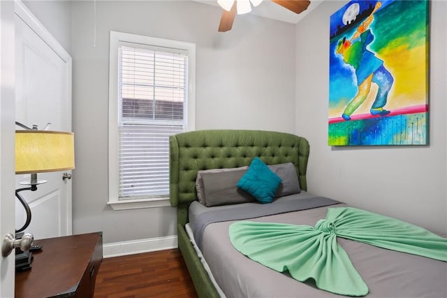 bedroom featuring ceiling fan and dark wood-type flooring