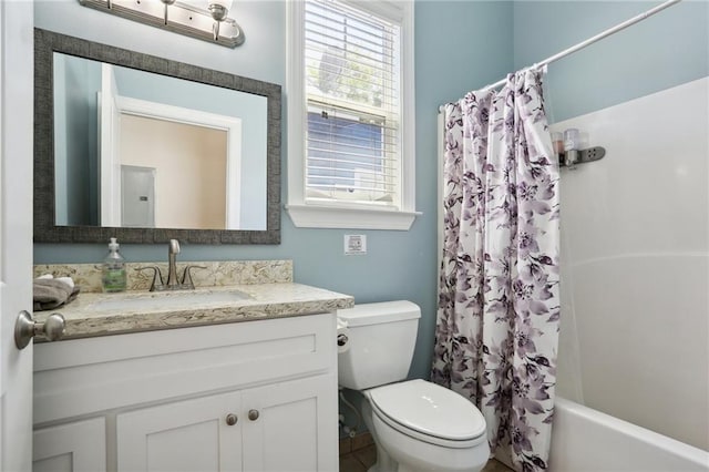 full bathroom with toilet, oversized vanity, and shower / tub combo