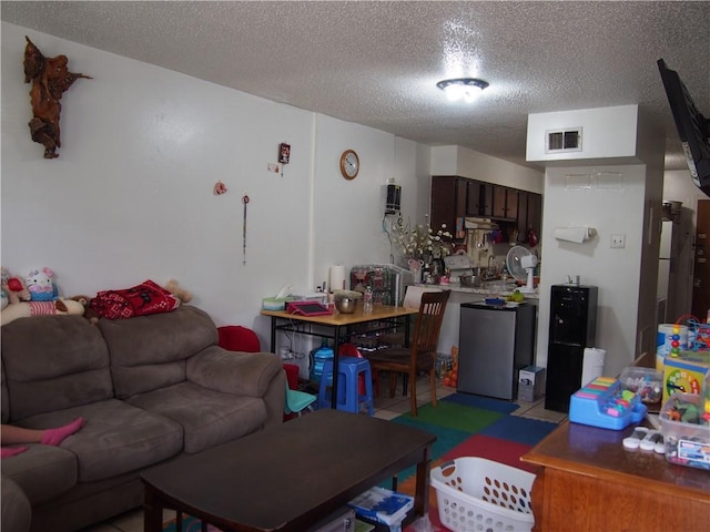 living room featuring a textured ceiling