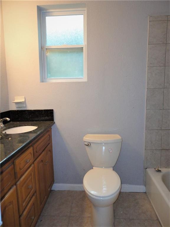 full bathroom with shower / tub combination, toilet, tile flooring, and vanity