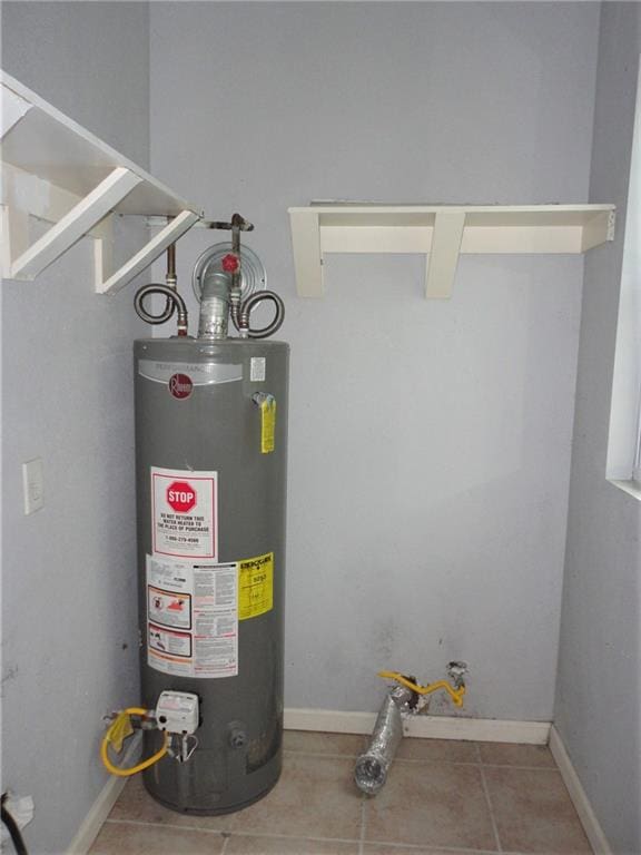 utility room featuring gas water heater