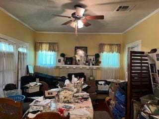 interior space featuring ceiling fan and crown molding