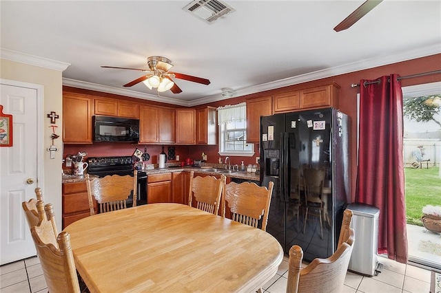 kitchen featuring light tile floors, ceiling fan, ornamental molding, black appliances, and sink