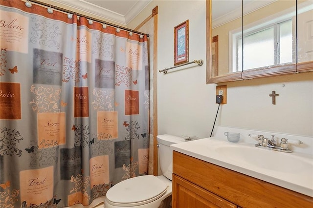 bathroom with vanity, toilet, and ornamental molding