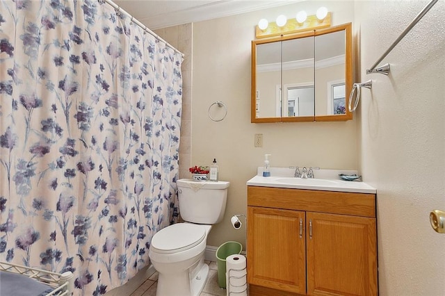 bathroom featuring ornamental molding, tile flooring, toilet, and vanity