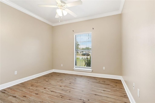 spare room featuring ornamental molding, ceiling fan, and light hardwood / wood-style flooring