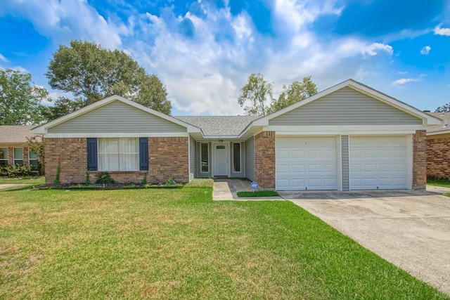 ranch-style house featuring a front lawn and a garage