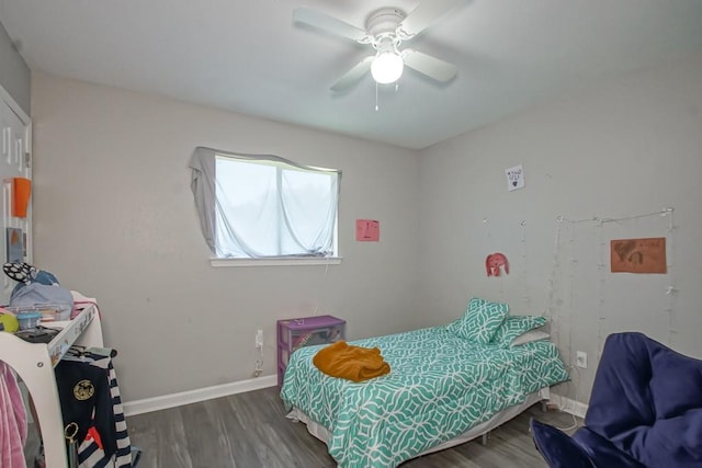 bedroom featuring ceiling fan and dark wood-type flooring