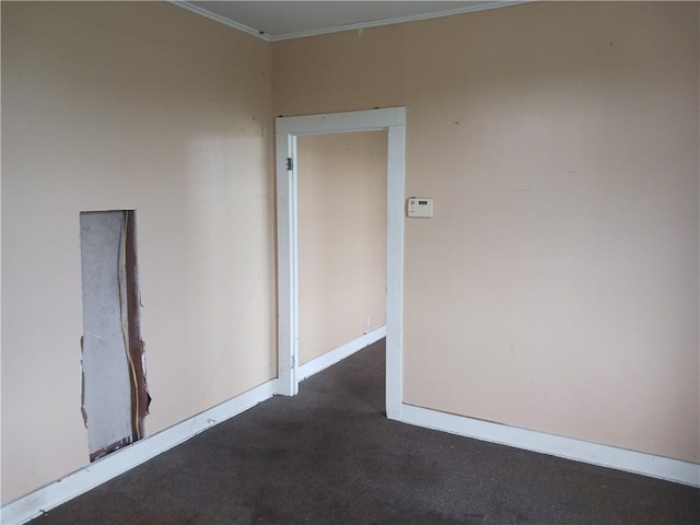 carpeted spare room with ornamental molding