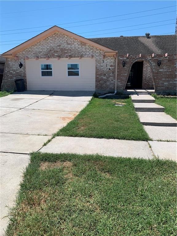 ranch-style home with a patio and a front yard