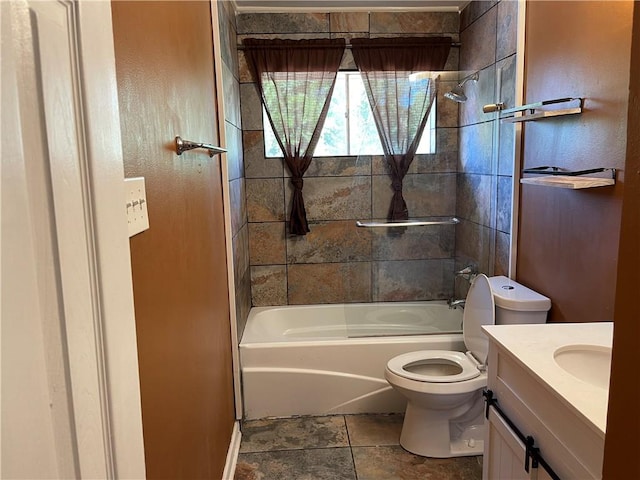 full bathroom featuring tile floors, toilet, vanity, and tiled shower / bath